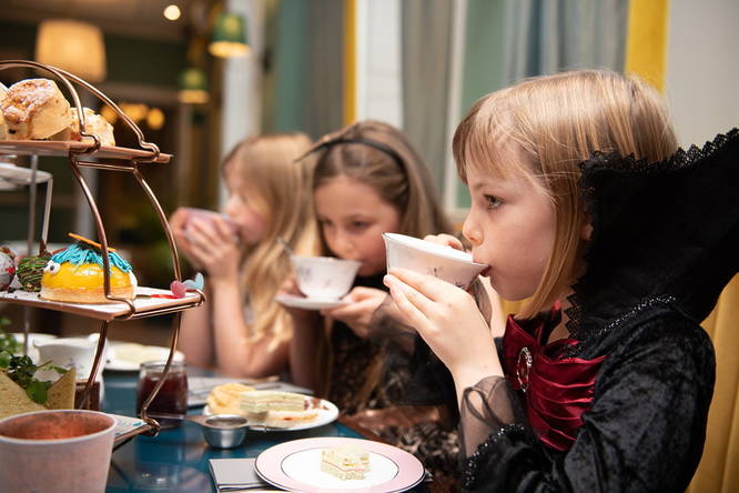 A group of kids enjoying a devilish afternoon tea at 144 on the Hill in Richmond 