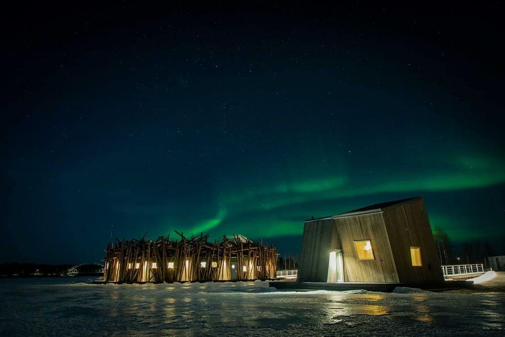 The Northern Lights flickering over the Artic Bath Hotel in Northern Sweden
