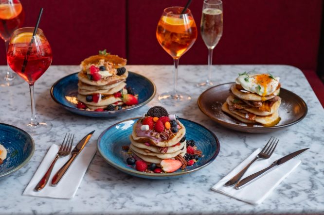 A delicious spread of pancakes and cocktails served at The King's House in Chelsea 