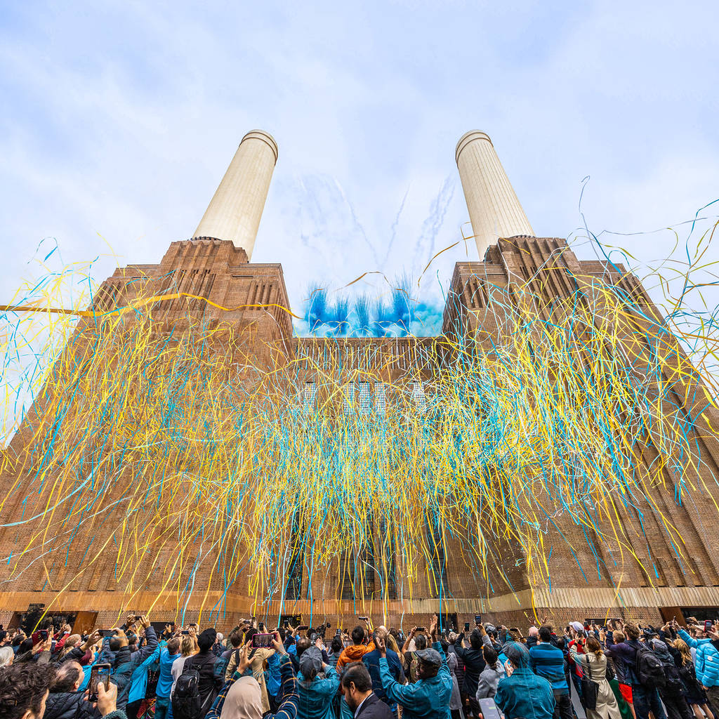 streamers bursting in front of battersea power station at the opening