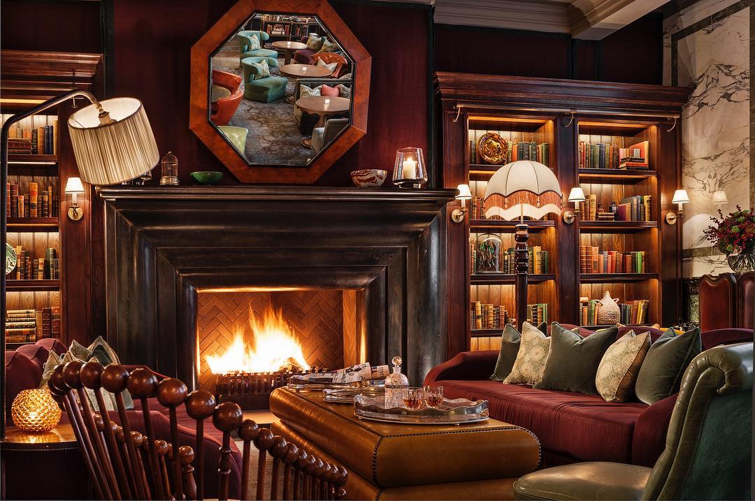 The warm and cosy interior and roaring fire of Scarfes Bar in Holborn, London 