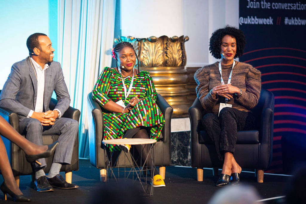 three panelists onstage at UK Black Business Week during Black History Month