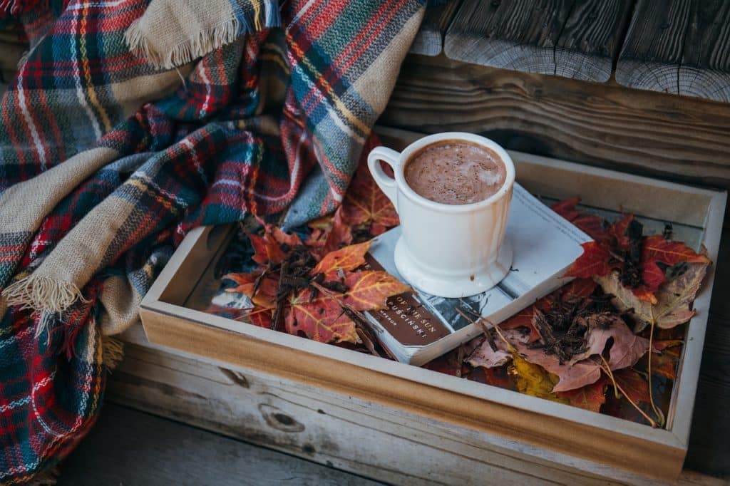 A picture of a Christmas-themed, steaming cup of hot chocolate