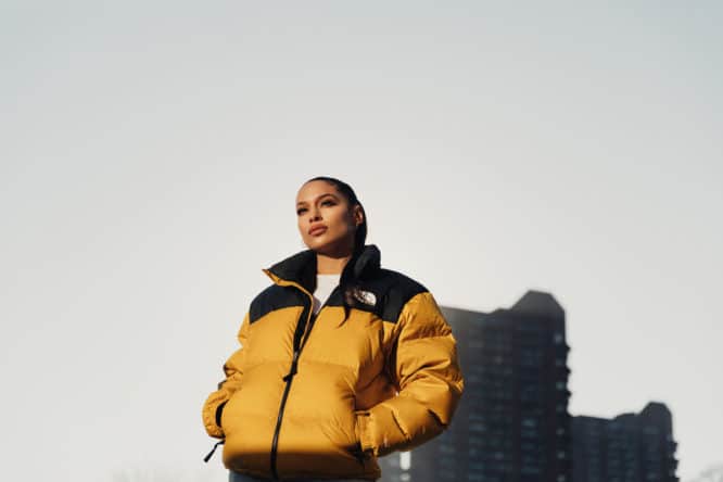 A picture of rapper Princess Nokia, one of the headliners performing at RALLY, standing in front of a skyscraper