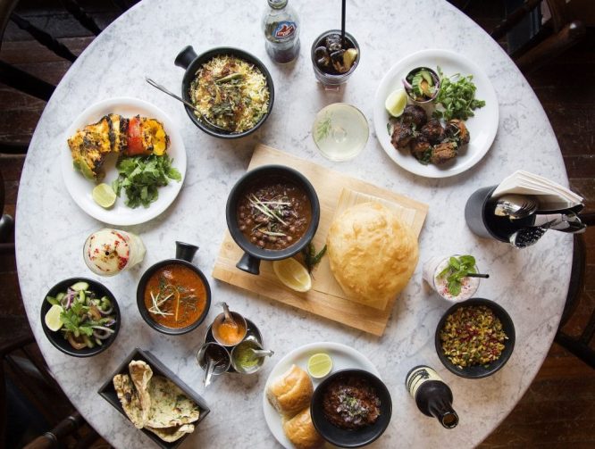 A large spread of tasty curries and sides at Dishoom in Soho