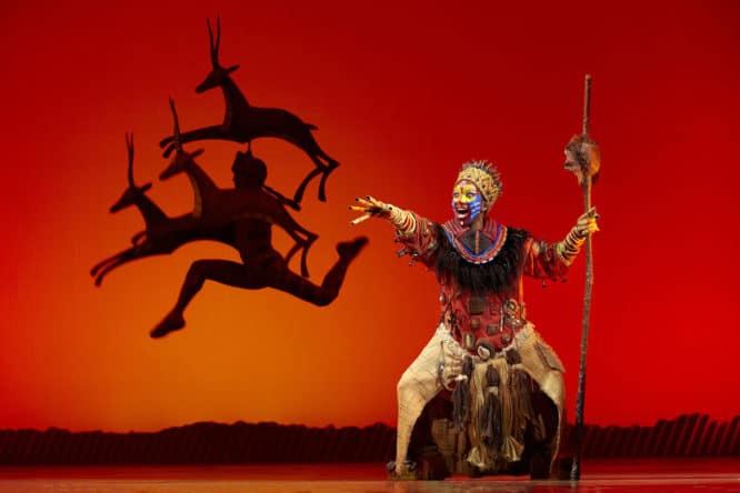 Rafiki and the gazelles on stage at Disney's The Lion King musical