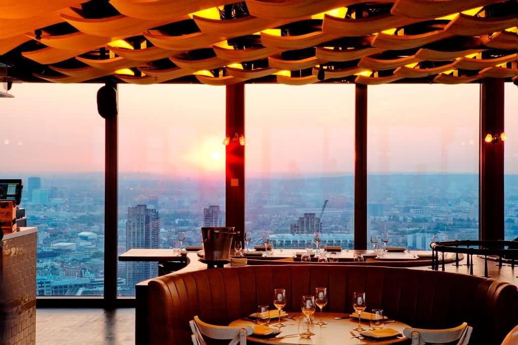 an early morning sunrise as seen from Duck & Waffle's 40th floor vantage point where they serve late night food