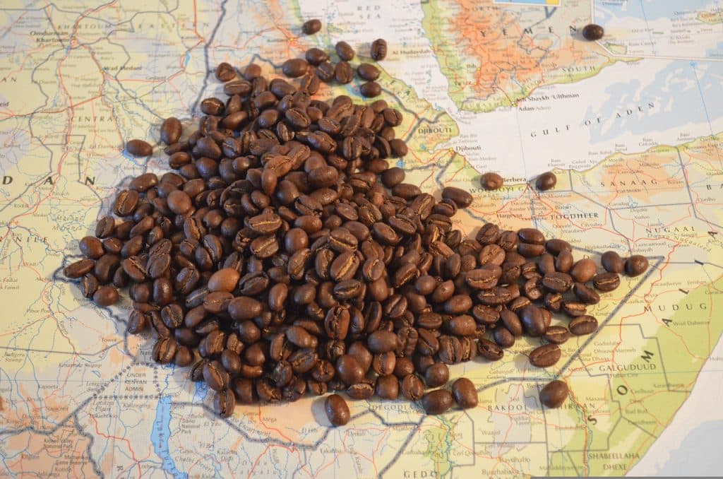 Some coffee beans on top of a map in Ethiopia in North Africa