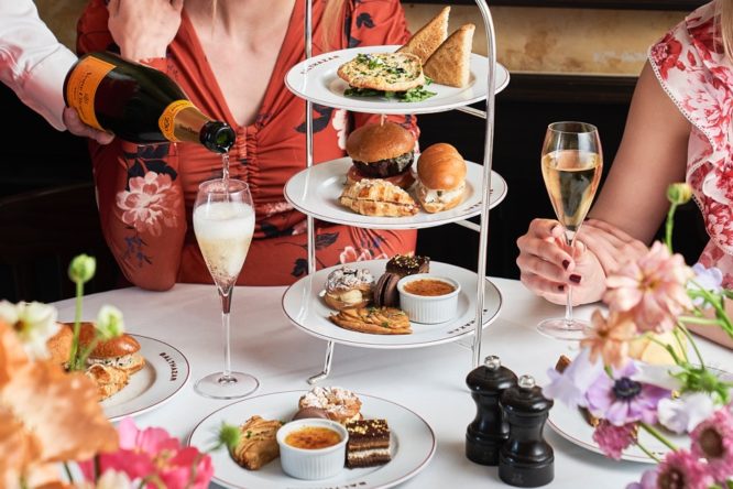 A spread of cakes and champagne at Balthazar in London