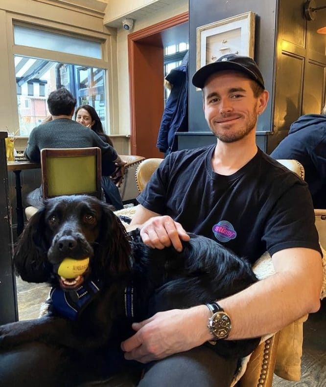 Our SEO Writer Sam eating out at a dog-friendly restaurant with his dog, Willow