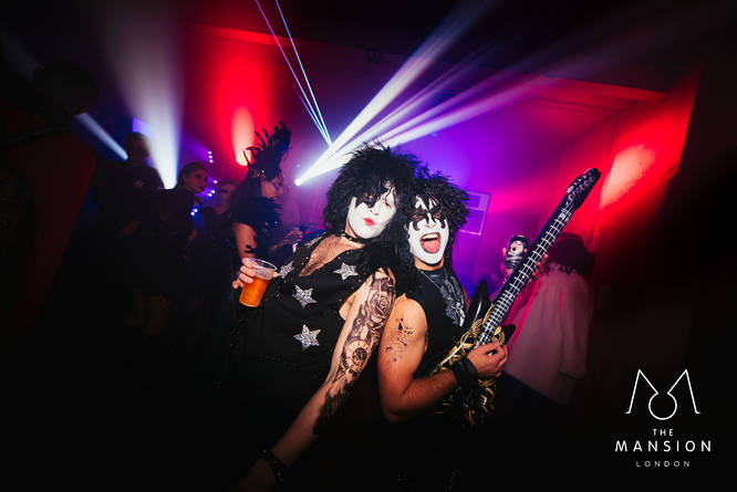 Two people dressed as the bank KISS at a Halloween party at the Red Mansion