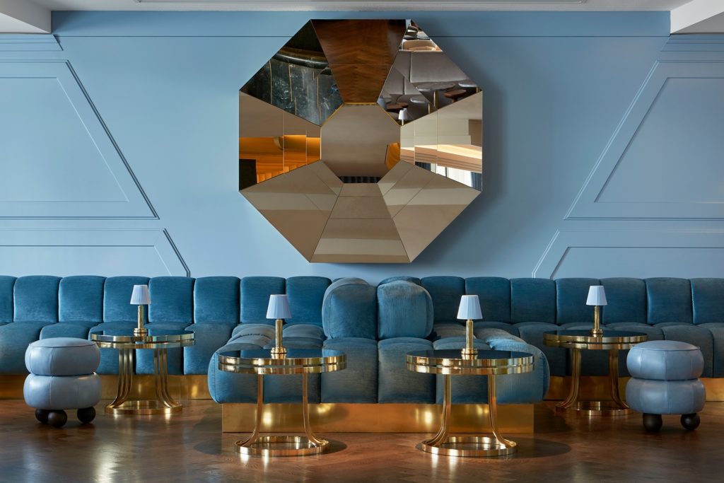 the blue, gold, and silver hued interior of one of London's prettiest bars, Lyaness