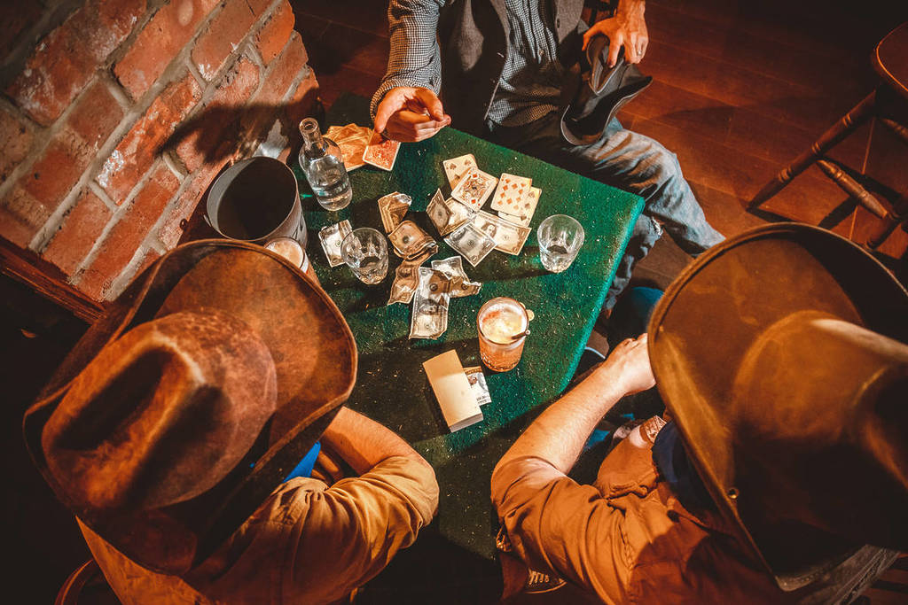 a card game at cocktail experience Moonshine Saloon