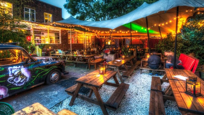 The garden at Magic Garden Pub lit up with fairy lights