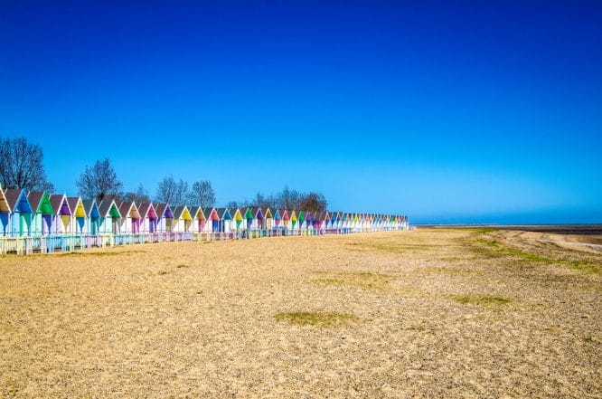 The famous beach huts at Mersea Island in Essex, one of the best hidden beaches near London 