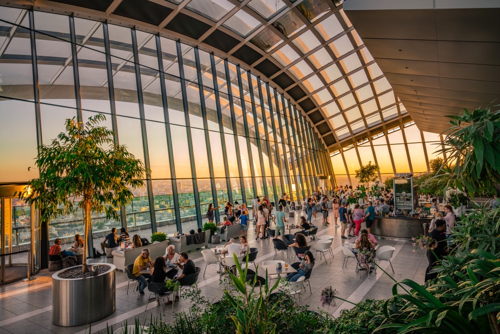 The view of the sun setting from the interior of the Sky Garden