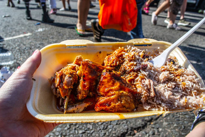 A delicious spread of jerk chicken and rice and peas served at one of the best food trucks in London