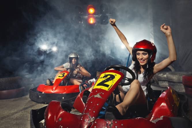 Two girls taking to a go karting track, one of the best hen do ideas in London