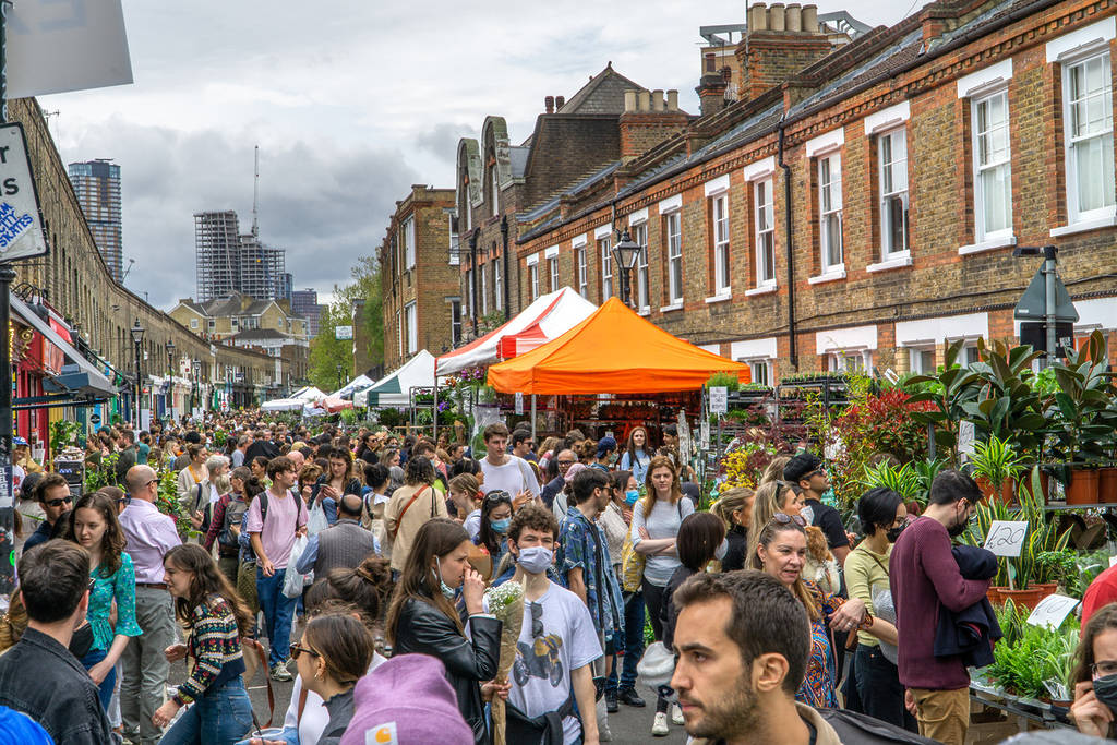 People milling around Columbia Road Flower Market, one of the best things to do in Bethnal Green