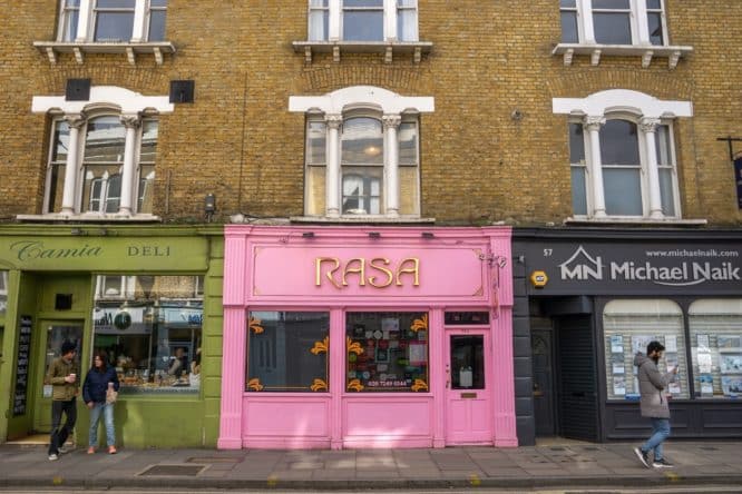 The exterior of the bright pink Indian restaurant Rasa in Stoke Newington 