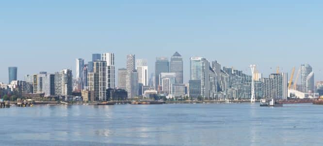 A view of the skyscrapers of Canary Wharf from the Thames Path in Deptford 