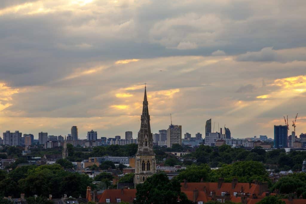 The sun setting over the towering spire of St. Giles Church in Camberwell, South East London
