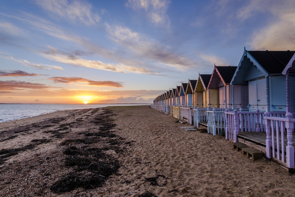 Beach huts at West Mersea at sunset.