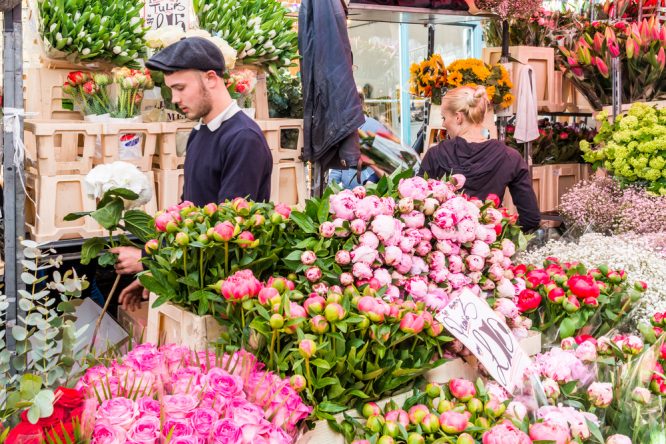 Sellers selling some beautiful flowers at the famous Columbia Road Flower Market