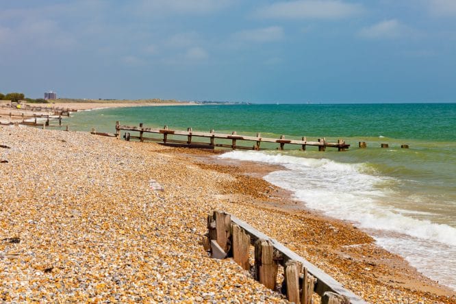 Groynes and a pebble beach at the beautiful Climping Beach