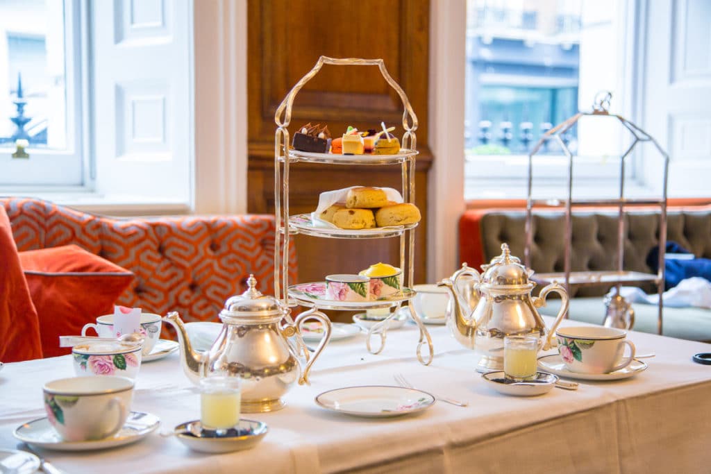 Some delicious cakes and sandwiches served with tea at one of the best places for afternoon tea in London