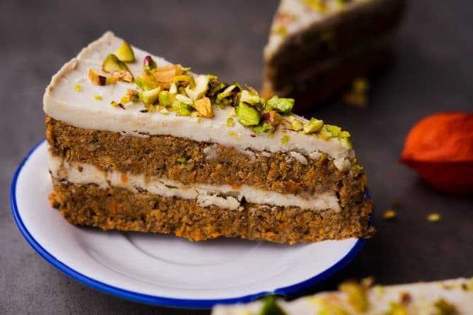 A delicious slice of carrot cake sprinkled with pistachios which you can find at bread A Manger