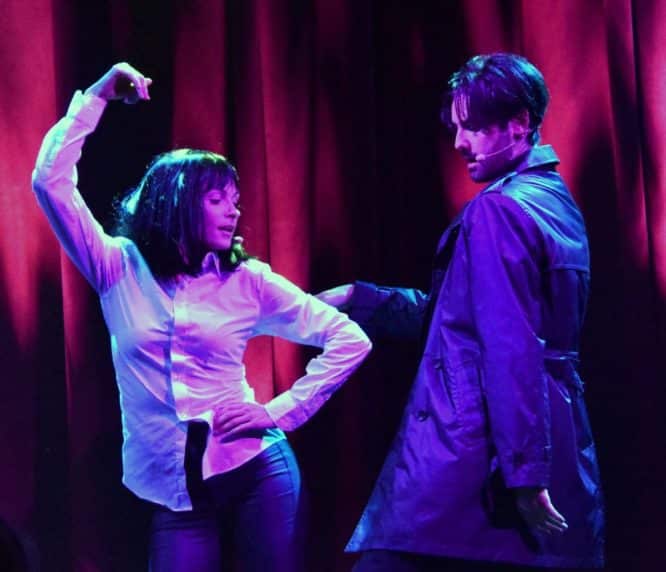 A woman dressed as Mia Wallace and a man dressed as Vincent Vega do the iconic twist dance from Pulp Fiction