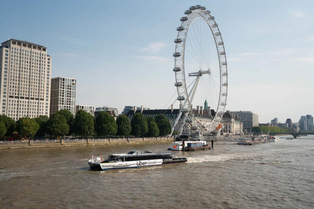 uber boat cruising past the London eye 