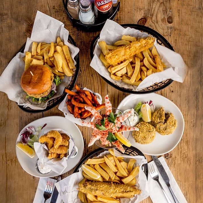 A delicious selection of fish and chips and burgers at Suttons and Sons – one of the best vegan restaurants in London