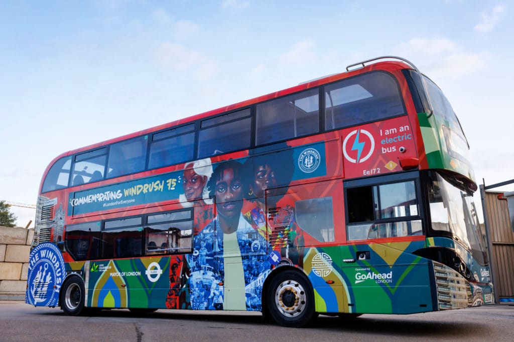 a double decker London bus decorated with a colourful design honouring Windrush pioneers