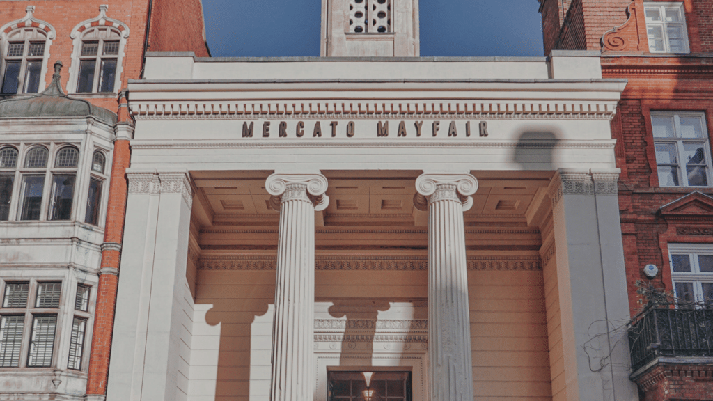the impressive columned entrance, emblazoned with 'mercato mayfair' above the impressive columns