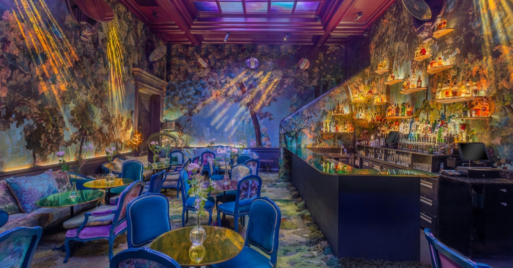 the glade room at sketch, a forest filled room with a dazzling verdant design scheme